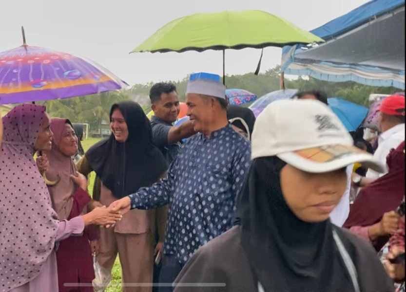 Diguyur Hujan, Warga Tetap Hadir di Kampanye Dialogis Haji Herman